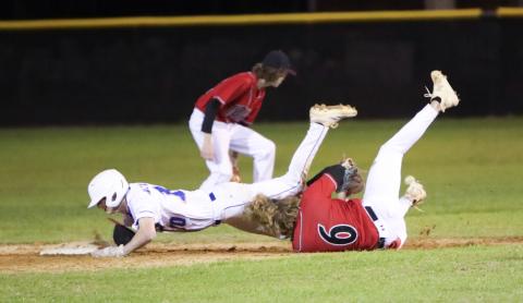 Branford shortstop Patrick Williams collides with Fort White shortstop Matthew Pitts as he tries to dive into second base Monday night. Pitts was called for obstruction and Williams was awarded an extra base. (BRENT KUYKENDALL/Lake City Reporter)