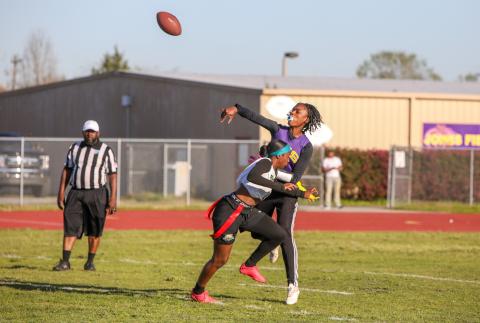 Columbia quarterback Eriel Baker throws a pass under pressure from a Buchholz defender on Tuesday night. (BRENT KUYKENDALL/Lake City Reporter)