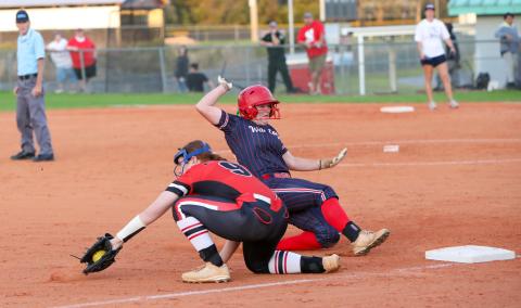 A throw to Fort White third baseman Hannah LeBleu isn't in time during Thursday's game against Wakulla. (BRENT KUYKENDALL/Lake City Reporter)
