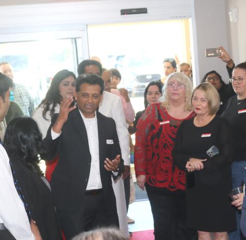 Nick Patel (left), Lake City Hotels Chief Operating Officer, the management company and owner of TownePlace Suites by Marriott, addresses the audience during Tuesday afternoon’s grand opening ceremony for the hotel. (TONY BRITT/Lake City Reporter)