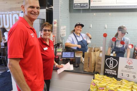 Jeff Wegner (from left), Lake City Christian Academy Special Olympics coach, and Marcia McAdams, a Columbia County Special Olympics representative, are served by Hannah Lagon, the district manager of the Lake City, Tallahassee and Valdosta, Ga., Jersey Mike’s restaurants, during the restaurant’s Giving Day on Wednesday. (TONY BRITT/Lake City Reporter)