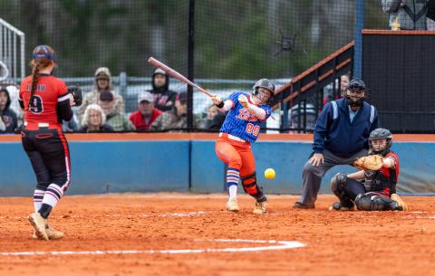 Branford catcher Morgan Brennan hits a two-RBI single off Fort White pitcher Hannah LaBleu in the second inning Monday night. (JACK HOWDESHELL/Lake City Reporter)