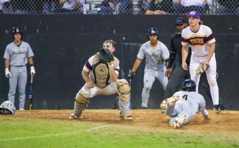 A throw is late to Columbia catcher Casen Maddox as Buchholz shortstop Hudson Sapp slides safely into home plate in front of Columbia pitcher Ayden Phillips on Friday. (BREN KUYKENDALL/Lake City Reporter)