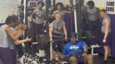 Columbia’s Chase Johnson celebrates with teammates after setting a personal record in the bench press during Wednesday’s meet against Hawthorne. (COURTESY)