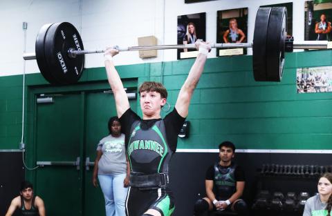 Suwannee’s Kamden Lang completes his clean and jerk rep during the Bulldogs’ meet against Madison County on Monday. (PAUL BUCHANAN/Lake City Reporter)