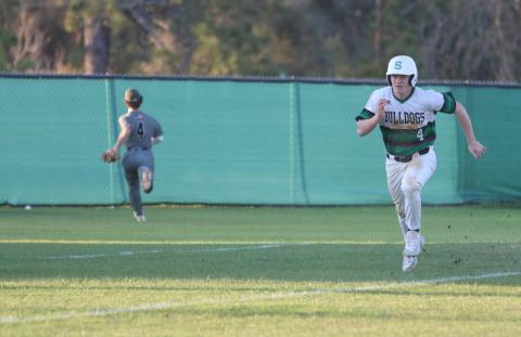 Suwannee first baseman Kyler Watson races home to score a run against Chiles on March 11. (PAUL BUCHANAN/Lake City Reporter)