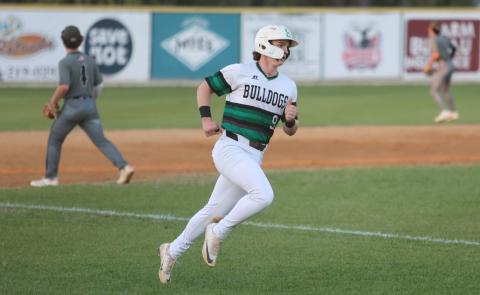 Suwannee's Jace Moran scores a run against Chiles on Tuesday night. (PAUL BUCHANAN/Lake City Reporter)