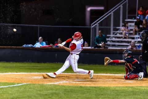 Lafayette third baseman Garrett Taylor hits a double against Fort White on Tuesday night. (JACK HOWDESHELL/Lake City Reporter)