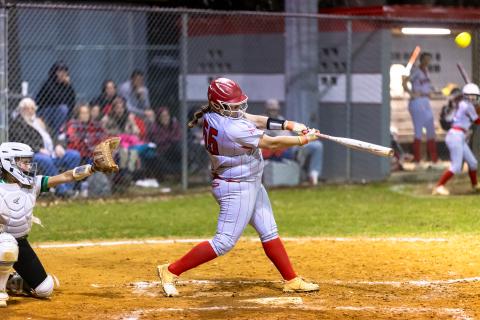 Lafayette pitcher Khloe Crotts hits a three-run homer in the bottom of the sixth inning against Suwannee on Thursday. (JACK HOWDESHELL/Lake City Reporter)