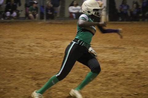 Suwannee center fielder Brianna Stephens rounds first base after hitting an RBI single against Gainesville on Feb. 25. (FILE)