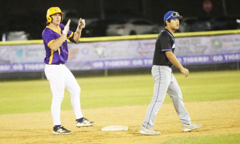 Columbia pitcher Ayden Phillips claps at second base after his two-RBI base hit against IMC Academy Gray on Friday night. (JORDAN KROEGER/Lake City Reporter)