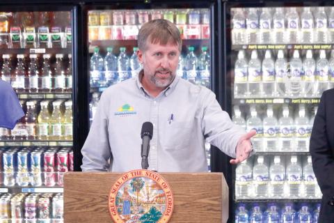 Suwannee County Commissioner Travis Land, pictured speaking at a press conference, said Matco Industries has shown no ambition to build its own rail spur at the county’s Catalyst Site the past 10 years. (FILE)