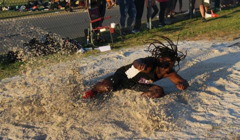 Columbia's Jeffrey Deal lands in the pit in the long jump at the Suwannee Mini Meet on Tuesday. (COURTESY)