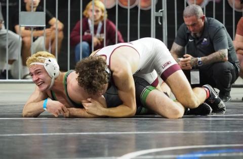 Suwannee wrestler Marshall White battles with First Baptist’s Andres DiGrigoli during the Class 1A IBT finals on Saturday. (DEE DEE JOLICOEUR/Special to the Reporter)