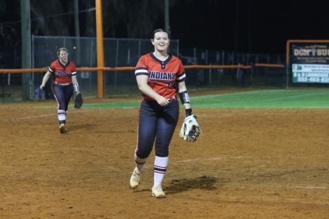 Fort White pitcher Kadence Compton is all smiles after striking out the final batter in Monday’s 7-5 win over Trenton as third baseman Hannah LeBleu cheers her on. (MORGAN MCMULLEN/Lake City Reporter)