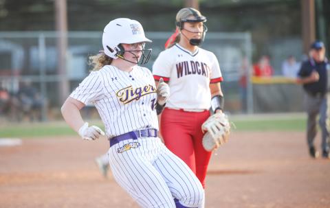 Columbia third baseman Alex Collins reaches first base after hitting a single against Baker County on April 17. (BRENT KUYKENDALL/Lake City Reporter)