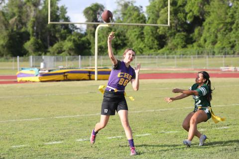 Columbia quarterback Mia Brasel rolls out to pass against Suwannee on Tuesday night. (BRENT KUYKENDALL/Lake City Reporter)