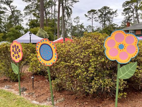 Wildflower displays welcome visitors to the Wildflower Festival at Heritage Park and Gardens last year. The festival returns May 10. A Chalk Art on the Trail will also be held this year on May 9. (COURTESY)