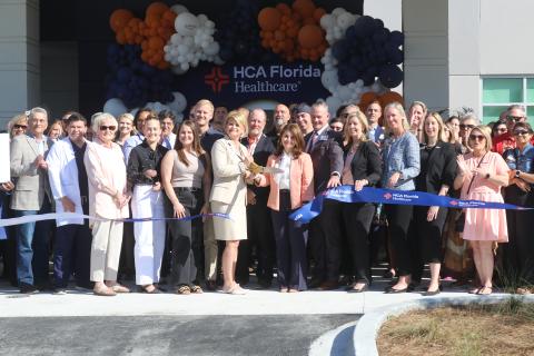 A crowd of well wishers, community supporters and local officials celebrate the ribbon cutting for the HCA Lake City Hospital’s expansion opening with board, administration and staff members on Tuesday. (TONY BRITT/Lake City Reporter)