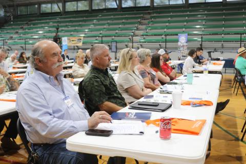 Live Oak City Manager Larry Sessions (left) listens during one of the presentations from state agencies about grant opportunities during the North Florida Transportation Planning Summit on Tuesday. Sessions was joined by Jerald Lee (second from left), the city’s public works director. (TONY BRITT/Lake City Reporter)