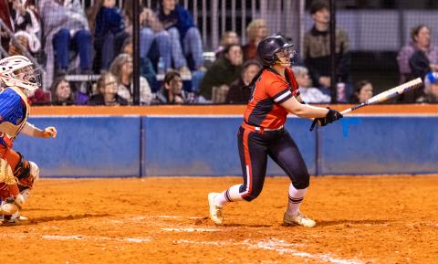 Fort White pitcher Kadence Compton watches her home run leave the park against Branford on March 10. (JACK HOWDESHELL/Lake City Reporter)