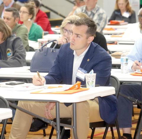 Lake City Mayor Noah Walker takes notes during one of the presentations at Tuesday’s North Florida Transportation Summit. (TONY BRITT/Lake City Reporter)