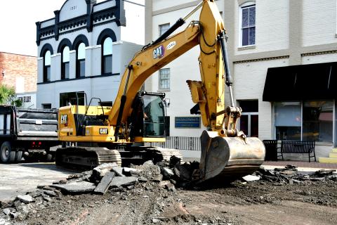 Crews with Live Oak Management Group tear up Howard Street (U.S. Highway 90) in downtown Live Oak on Monday to fix settling in the street that occurred following a water leak in December. (ROB WOLFE/Lake City Reporter)