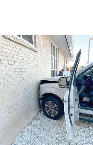 A pickup crashed into the Lake City Public Safety Building on Thursday morning after the driver accidentally hit the accelerator instead of the brake as she pulled into a parking spot. (COURTESY)