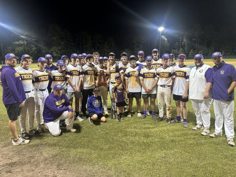 Columbia’s baseball team poses with the District 3-5A trophy after defeating Ridgeview on Thursday. (JORDAN KROEGER/Lake City Reporter)