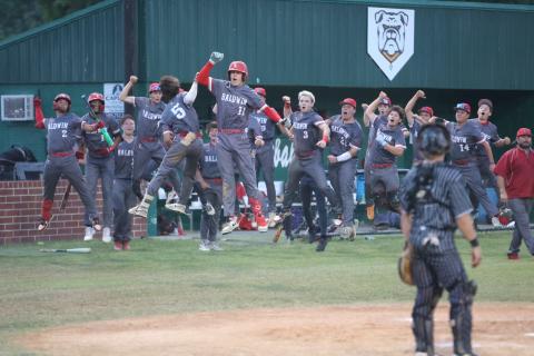 Baldwin's Turner Farah celebrates with teammates after hitting a home run while Suwannee catcher Grayson Bonds looks on during Game 2 of the Region 1-3A quarterfinals on Tuesday. (PAUL BUCHANAN/Lake City Reporter)