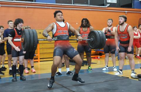 Fort White's Lecosta Byrd brings the bar up during the clean and jerk at the District 6-1A meet on March 28. (PAUL BUCHANAN/Lake City Reporter)