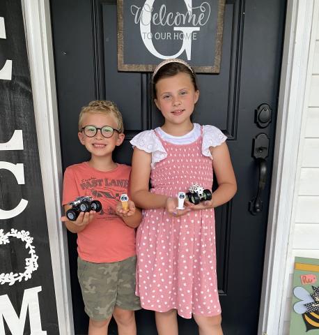 Lincoln Gaddy shows off ‘Bone Snake,’ his custom diecast monster truck, and the championship trophy the truck won in OurTime4Adventures’ Kids Custom Easter tournament. Harper, his sister, previously defeated him in a 1-on-1 race on her birthday. (COURTESY)