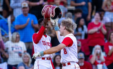 Lafayette second baseman Dawson Cannon (8) celebrates with outfielder Tywan Williamson following his solo home run against Aucilla Christian during Game 2 of the Region 3-R semifinals on Tuesday. (JACK HOWDESHELL/Lake City Reporter)