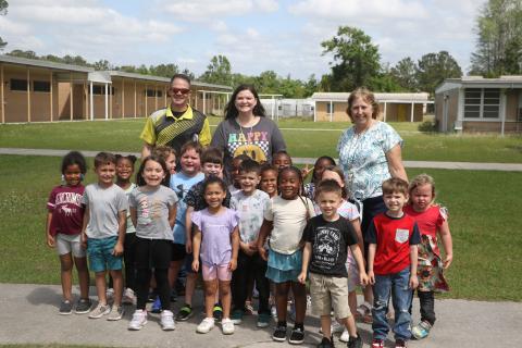 Summers Elementary School VPK paraprofessional Kelsie Rodriguez (back middle) has been named a finalist for the state’s School-Related Employee of the Year award. Rodriguez is pictured with her VPK students as well as Summers Principal Robert Cooper and VPK teacher Karen McDonald. (MORGAN MCMULLEN/Lake City Reporter)
