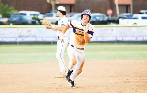 Columbia’s Ayden Phillips races to third base during Friday’s win over Flagler Palm Coast. (BRENT KUYKENDALL/Lake City Reporter)
