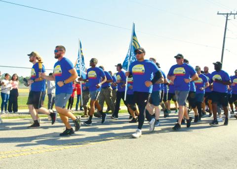 Law enforcement officials take part in Friday’s annual Law Enforcement Torch Run. (ROB WOLFE/Lake City Reporter)