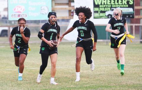 Suwannee defensive back Jessica Tran (1) celebrates with teammates Kayla Frederick-Woods (2), Alaira Handy (8) and Miranda Ramsey (7) after scoring on a pick-6 against Santa Fe during the Region 1-1A quarterfinals on Wednesday. (PAUL BUCHANAN/Lake City Reporter)