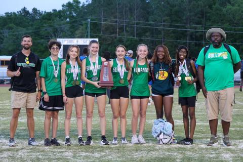 The Suwannee girls track and field team placed second at the District 2-2A meet on Tuesday. Pictured are coach Brian Bullock (from left), Montana Lewis, Ryleigh Hermanson, Arwen Haley, Olivia Hermanson, Madison Chamberlain, Jo’Keria McMullen, Kennedy Jennings and coach Twon Williams. (COURTESY)