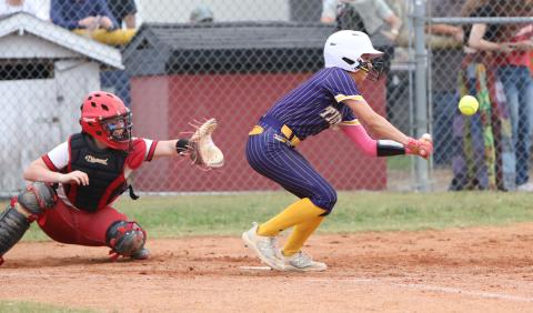 Columbia shortstop Lillyenne Mayhew tries to get down a bunt against Baker County in the District 3-4 championship on Thursday. (BRENT KUYKENDALL/Lake City Reporter)