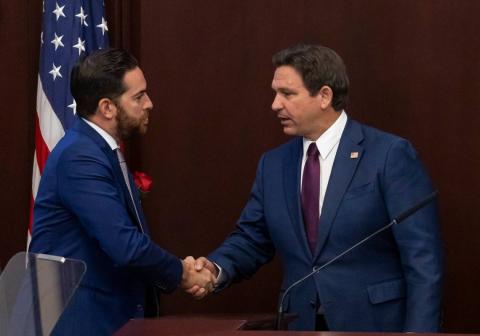 Florida Governor Ron DeSantis (right) shakes hands with Florida House Speaker Daniel Perez after delivering his State of the State during the first day of the legislative session at the Florida State Capitol on March 4 in Tallahassee. (MATIAS J. OCNER/Miami Herald/TNS)