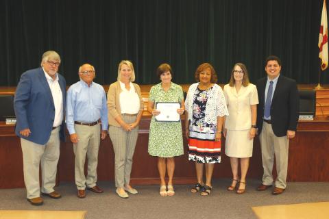 Sara Lou Blanton (center), along with John Brown, Linda Moses and Arthur ‘Art’ Holliday, were honored at Tuesday’s Teacher of a Lifetime ceremony at the Keith Hudson School Board Auditorium. (TONY BRITT/Lake City Reporter)