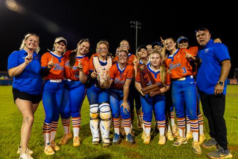 Branford's softball team poses with the District 6-R trophy after defeating Fort White 3-1 on Thursday. (JACK HOWDESHELL/Lake City Reporter)