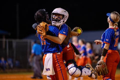 Branford catcher Morgan Brennan (right) celebrates with first baseman Mallory Blue (15) following the final out of the Buccaneers' 6-0 victory over Fort White in the Region 3-R semifinals on Thursday. (JACK HOWDESHELL/Lake City Reporter)