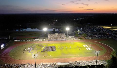 The sun sets Friday night over Tiger Stadium during Columbia High’s commencement ceremony for the Class of 2025. (RAY CARPENTER/Lake City Reporter)