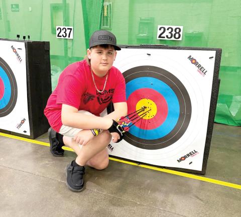 Lake City Middle School’s Chase Bryant is pictured at the Eastern National Archers in Schools Program tournament in Kentucky in early May. Bryant qualified for the NASP World Tournament. (COURTESY)