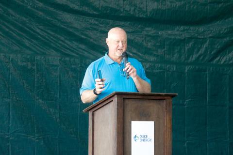 Duke Energy’s Jay Oliver holds up his cell phone as he talks Tuesday about how important batteries are to not just everyday life but also to the electric grid. (JAMIE WACHTER/Lake City Reporter)