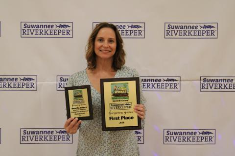 Lake City’s Rachel Grubb with her two prize plaques from last year’s WWALS River Revue. Grubb will headline this year’s event. (COURTESY KAREN CORBIN)