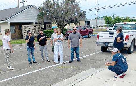 Friends and family of William Powell Jr., the 18-year-old shot and killed in White Springs on Saturday, which includes Hunter Daniels, Stormy Smith, Jake Cribbs, Joedy Powell, Briana Powell, Jamie Blankenship and Sherry Blankenship wait for the press briefing to begin Tuesday morning outside of the Hamilton County Courthouse. (JASON WILKINSON/Lake City Reporter)