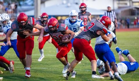 Lafayette running back Alex Townsend (20) runs in for a touchdown behind the block of Dayne McCray (3) during the Hornets’ half of action against Interlachen during Tuesday’s spring jamboree. (JACK HOWDESHELL/Lake City Reporter)