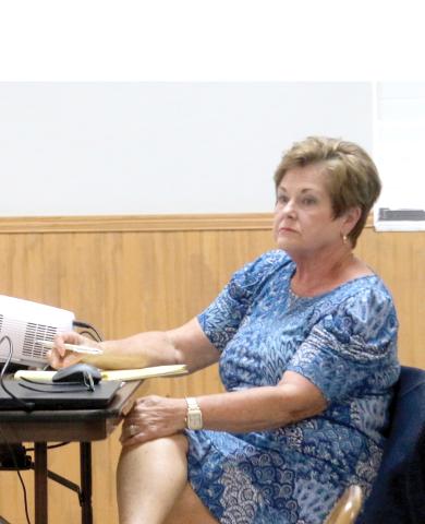 Connie Brecheen, listening at a Fort White town meeting, was selected as the White Springs interim manager Thursday. (FILE)